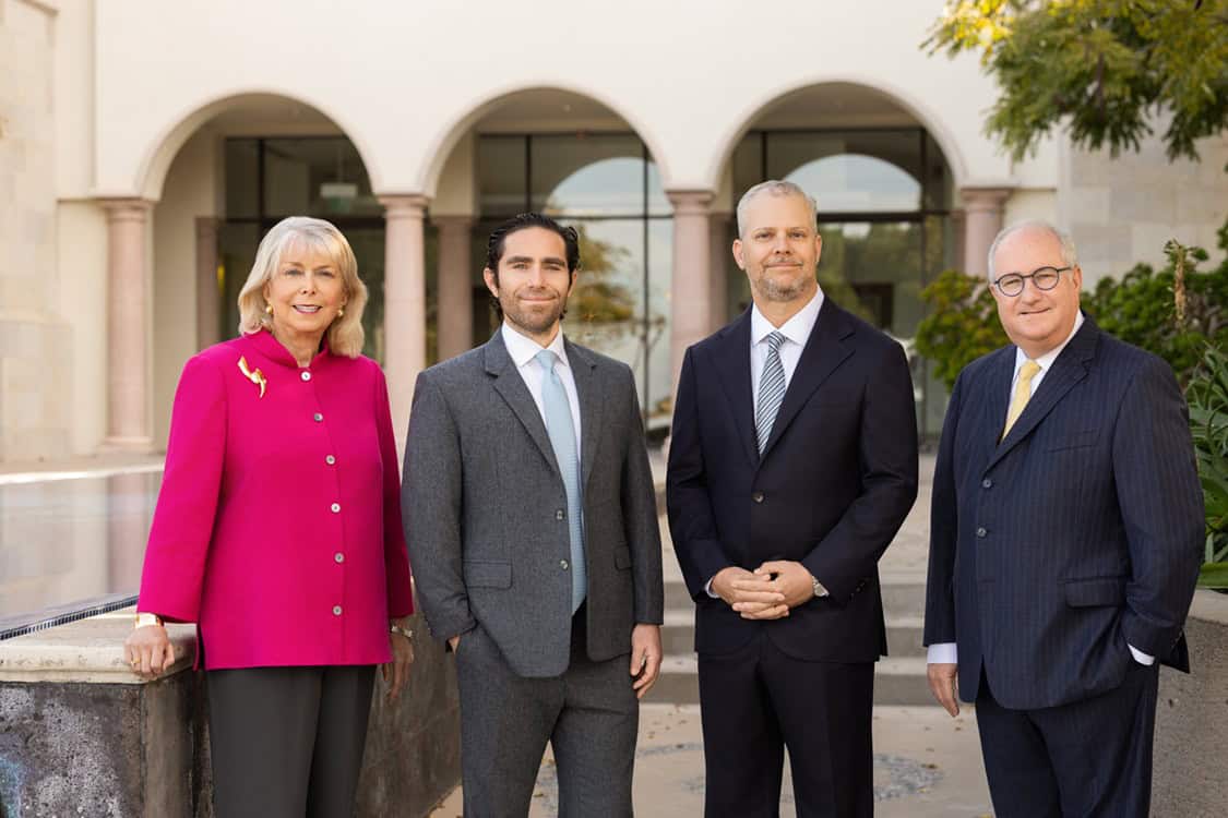 Attorneys of The Schenk Law Firm, LLP standing together outside the firm's San Diego office